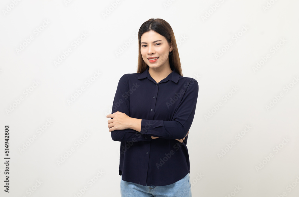 Beautiful young woman age around 25 smiling and happy. Charming female standing with arms crossed on isolated white background. Asian people pose looking camera with white backdrop. Beautiful young woman age around 25 smiling and happy. Charming female standing with arms crossed on isolated white background. Asian people pose looking camera with white backdrop.