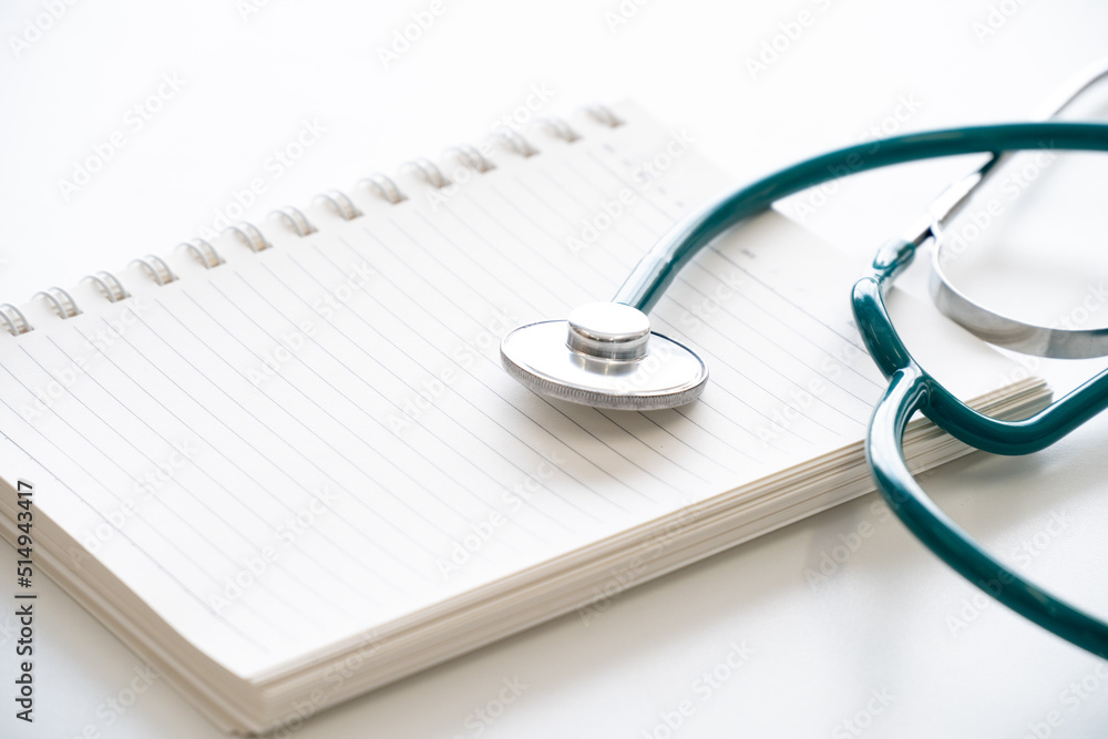 Stethoscope medical equipment on blank notebook,isolated on white background. Stethoscope medical equipment on blank notebook,isolated on white background.