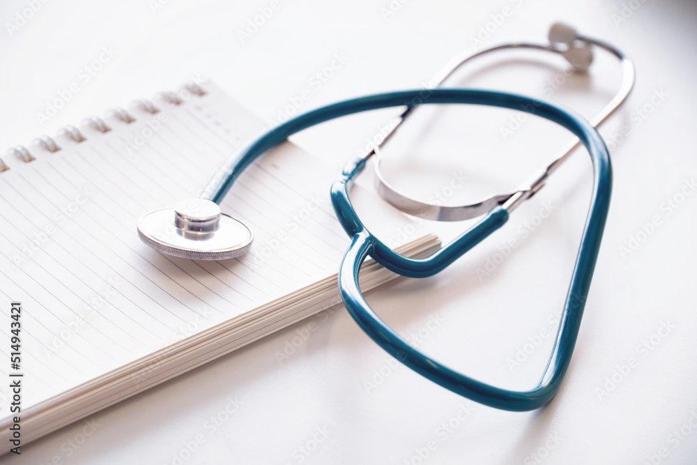 Stethoscope medical equipment on blank notebook,isolated on white background. Stethoscope medical equipment on blank notebook,isolated on white background.
