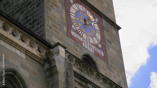 The clock tower of the medieval gothic old church called the Black Church in Brasov, Romania