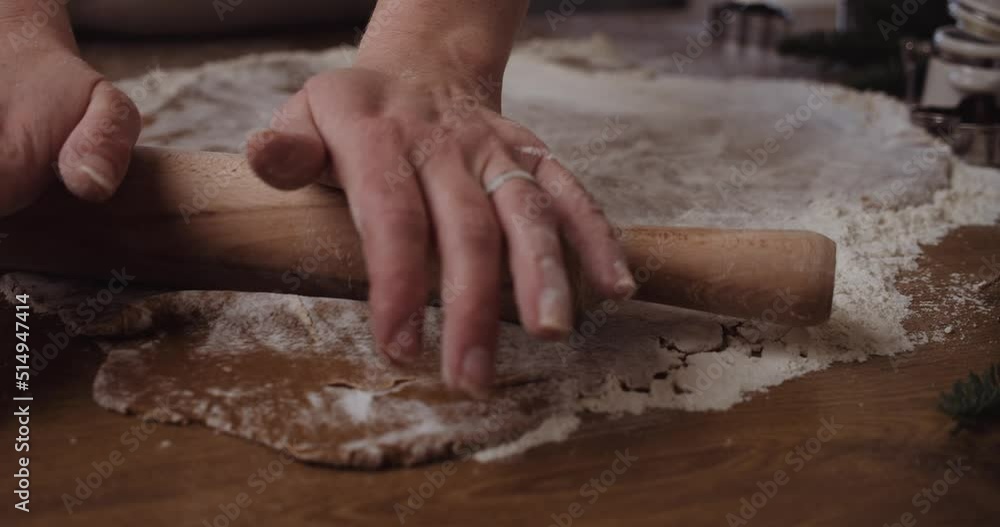 Rolling Gingerbread Dough for Christmas Cookies, Close Up on Hands Rolling Gingerbread Dough for Christmas Cookies, Close Up on Hands