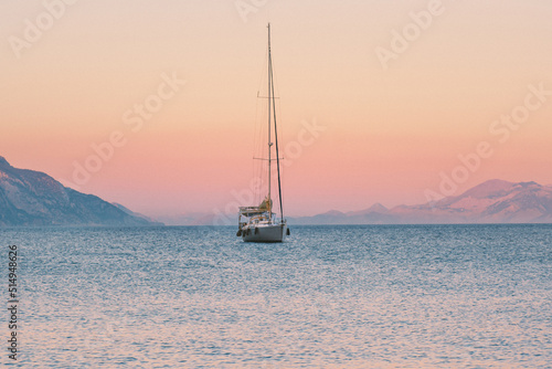 Fototapeta Naklejka Na Ścianę i Meble -  Sailing boat in Aegean sea sunset landscape travel yachting tour cruise beautiful scenery