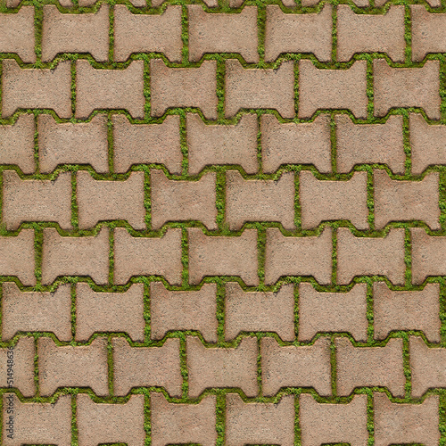 Seamless texture of green grass sprouted between bricks of cobblestone path, top view. Concept of harmonious fusion of city and nature. 