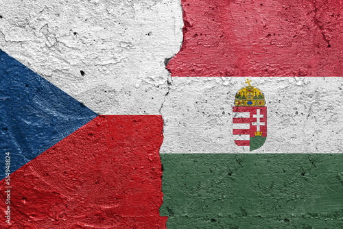 Czech Republic and Hungary - Cracked concrete wall painted with a Czech flag on the left and a Hungary flag on the right stock photo