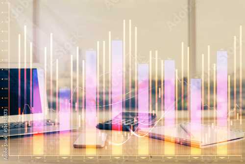 Forex market chart hologram and personal computer background. Double exposure. Concept of investment. © peshkova