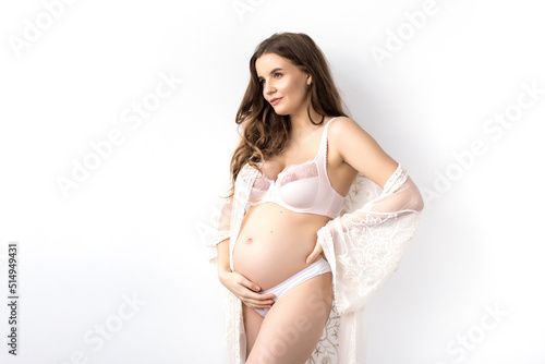 young attractive pregnant woman holding her belly