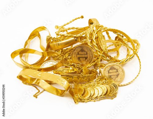 Heap or stack of variety traditional Turkish scrap gold and coins isolated on white background.