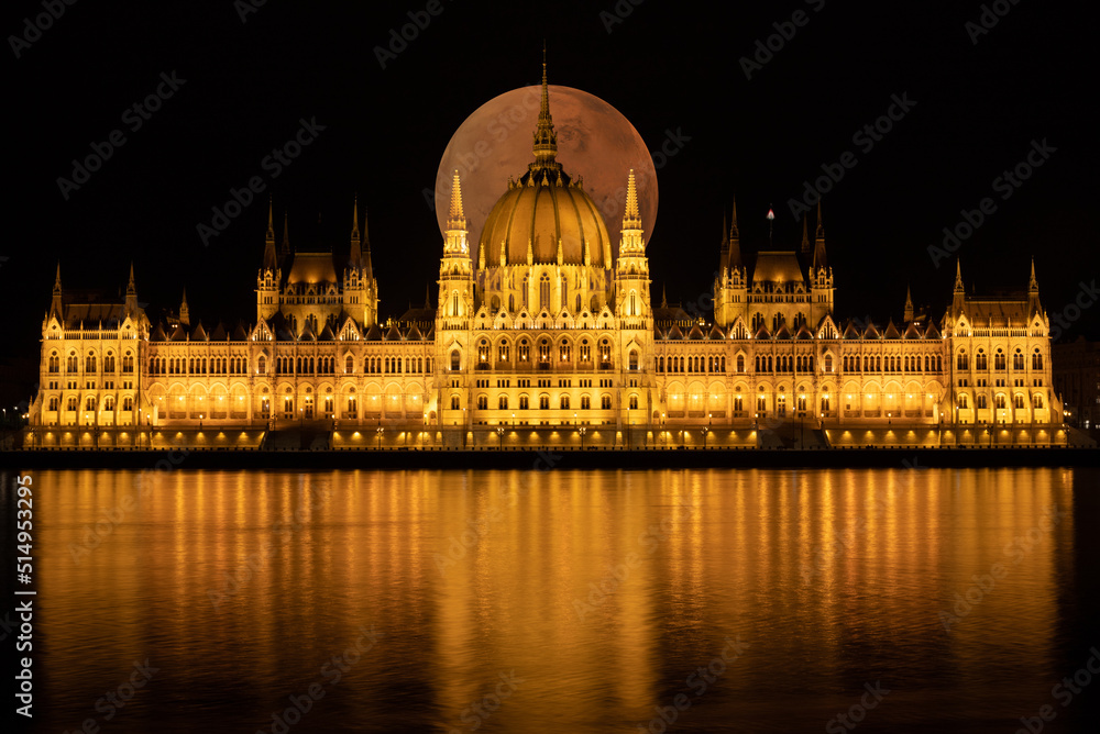 Budapest Parliament Building seen at night with full moon