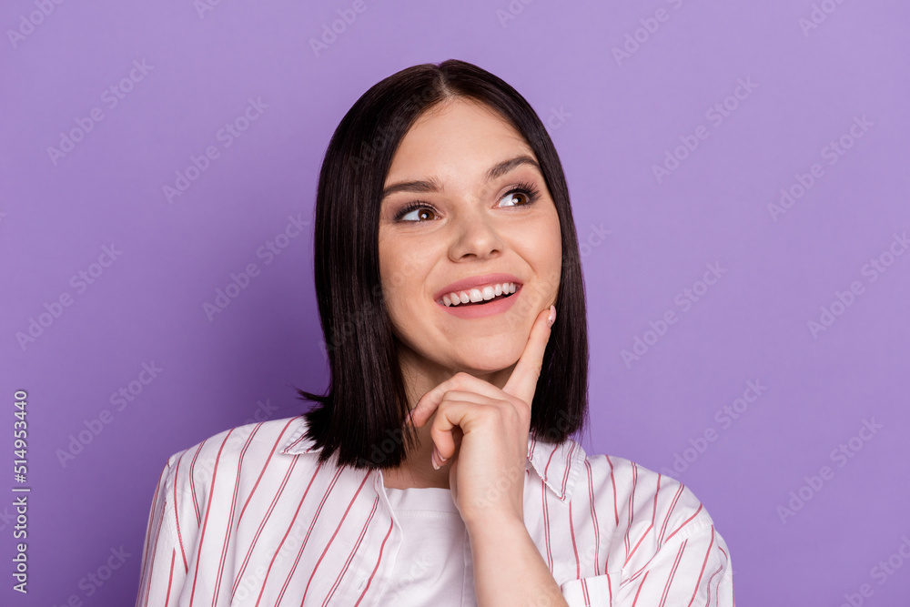 Photo of young cheerful lady finger touch chin dreamy curious look empty space isolated over violet color background Photo of young cheerful lady finger touch chin dreamy curious look empty space isolated over violet color background
