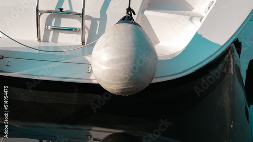 pupa of sailing boat white luxury protected with fenders while at marina berth harbour © Ela
