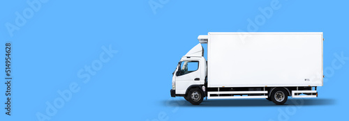 Delivery white van with space for text on blue background, panoramic banner photo