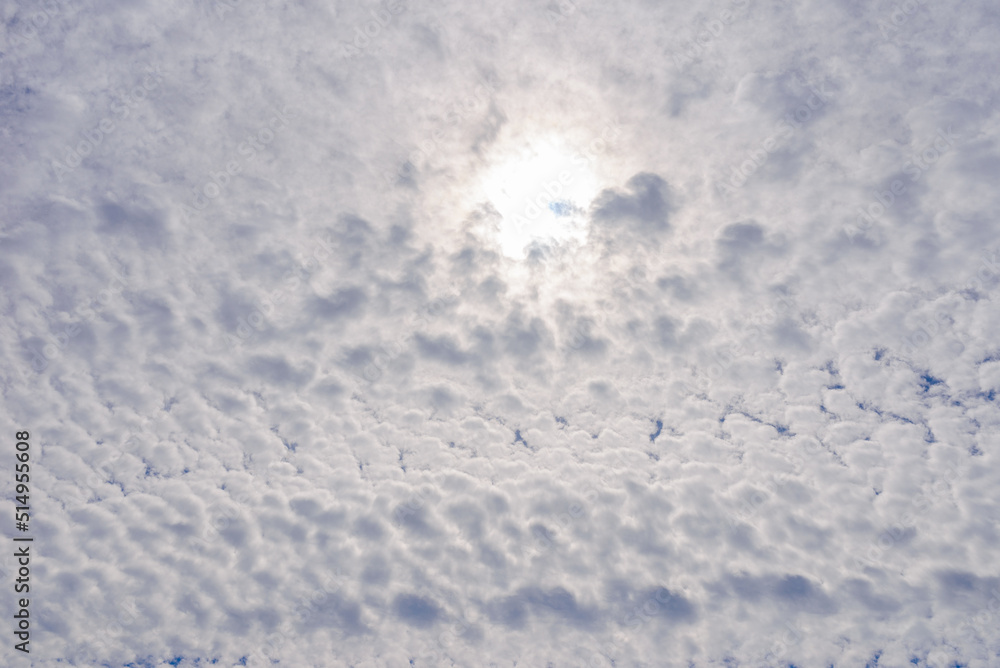 Sky fluffy clouds,white sky with clouds and sun.Beauty cloudy day.