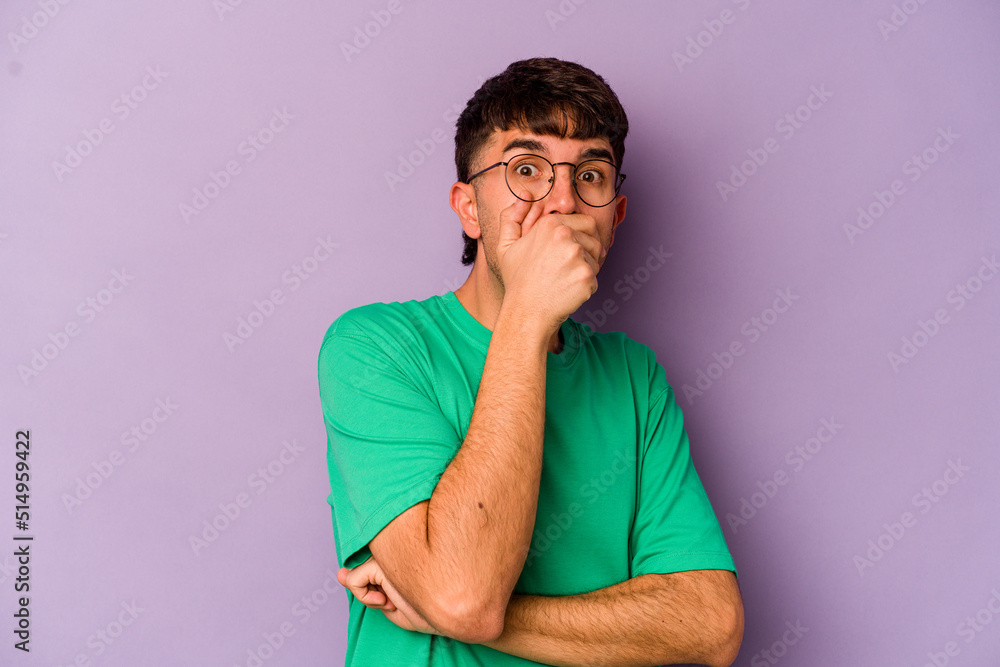 Young caucasian man isolated on purple background scared and afraid. Young caucasian man isolated on purple background scared and afraid.