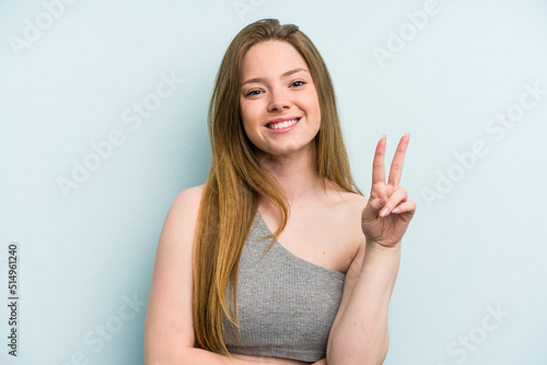 Young caucasian woman isolated on blue background showing number two with fingers.