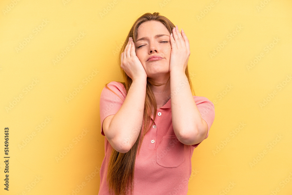 Young caucasian woman isolated on yellow background crying, unhappy with something, agony and confusion concept. Young caucasian woman isolated on yellow background crying, unhappy with something, agony and confusion concept.
