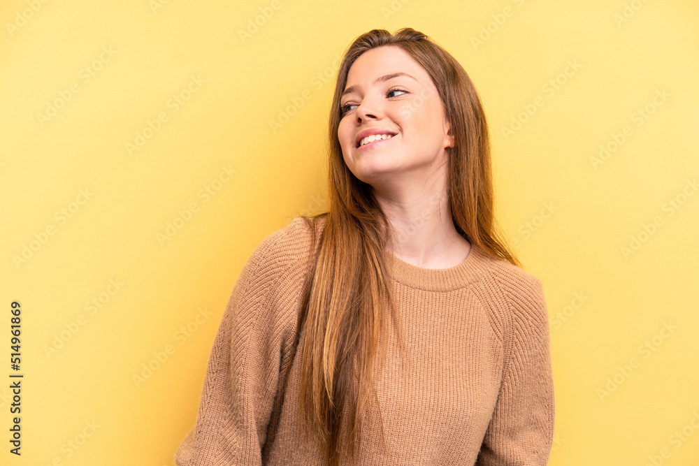 Young caucasian woman isolated on yellow background relaxed and happy laughing, neck stretched showing teeth. Young caucasian woman isolated on yellow background relaxed and happy laughing, neck stretched showing teeth.