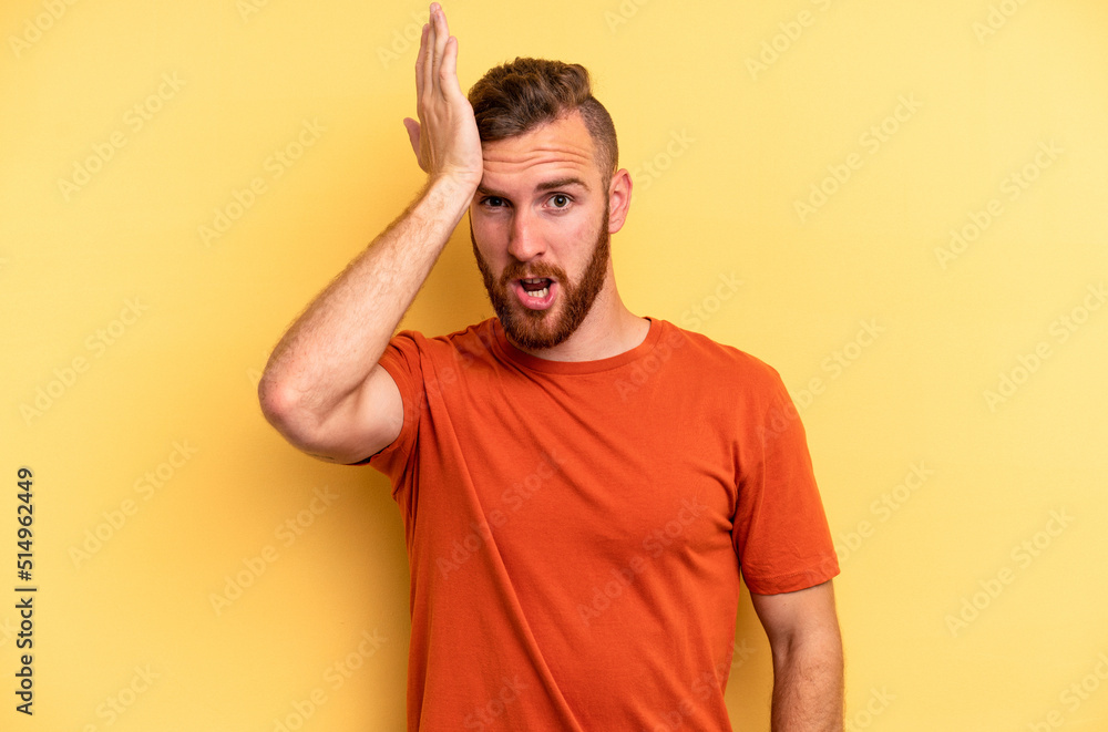 Young caucasian man isolated on yellow background forgetting something, slapping forehead with palm and closing eyes. Young caucasian man isolated on yellow background forgetting something, slapping forehead with palm and closing eyes.