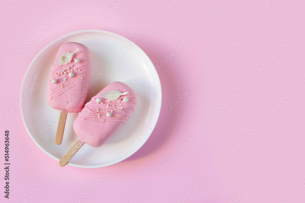 Eskimo cake. Ice cream sweet eskimo with pink chocolate icing. Chocolate covered ice cream on stick, pink background. Sweets background, sweet price concept, Ice cream template, summer sale layout. Eskimo cake. Ice cream sweet eskimo with pink chocolate icing. Chocolate covered ice cream on stick, pink background. Sweets background, sweet price concept, Ice cream template, summer sale layout.