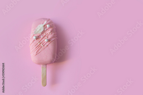 Eskimo cake. Ice cream sweet eskimo with pink chocolate icing. Chocolate covered ice cream on stick, pink  background. Sweets background, sweet price concept, Ice cream template, summer sale layout.