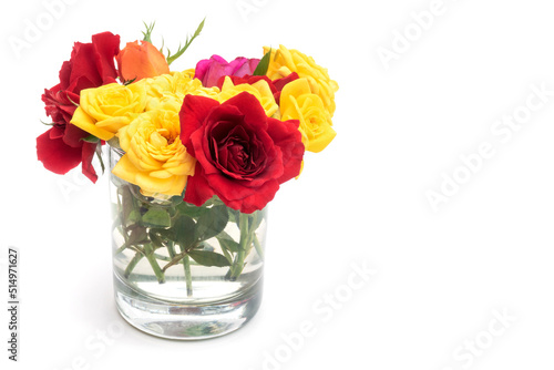 Roses in transparent vase isolated on white background. Copy space for text