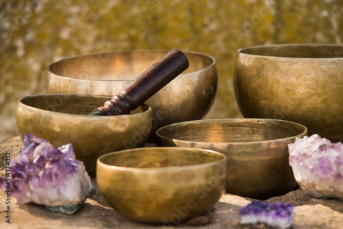 Still life with Tibetan bowls on rocks.
