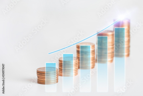 Stacks of money coins and increasing graph. Finance, investment, profit growth concept