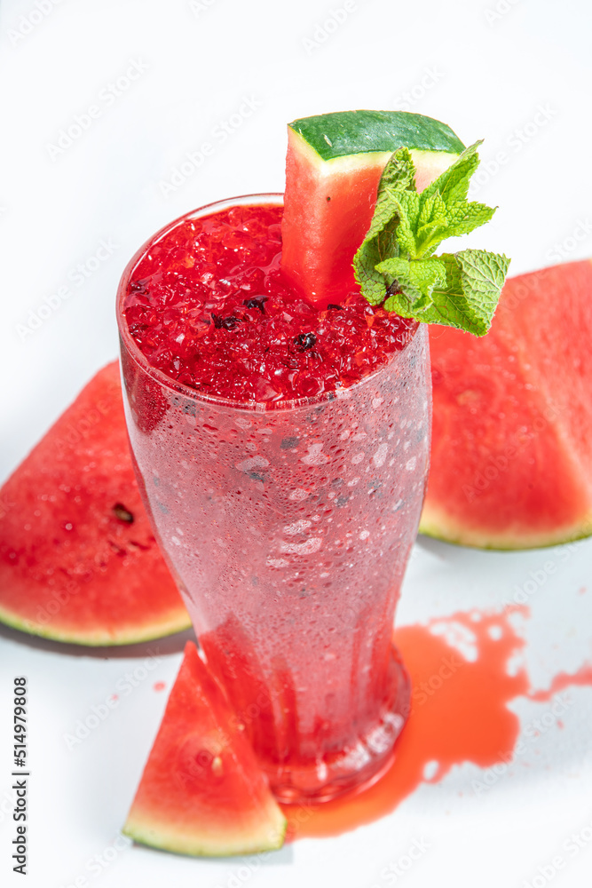 Refreshing cold summer drink watermelon slushie, iced Granita dessert beverage, crushed watermelon ice on trendy high-colored white pink background copy space Refreshing cold summer drink watermelon slushie, iced Granita dessert beverage, crushed watermelon ice on trendy high-colored white pink background copy space