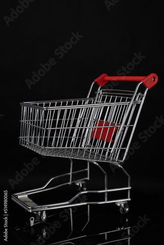 Shopping cart on black background