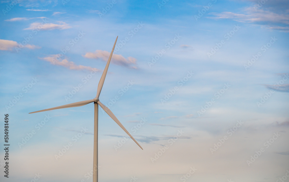 Fototapeta premium Wind turbine generator with blue sky - energy conservation concept. thailand