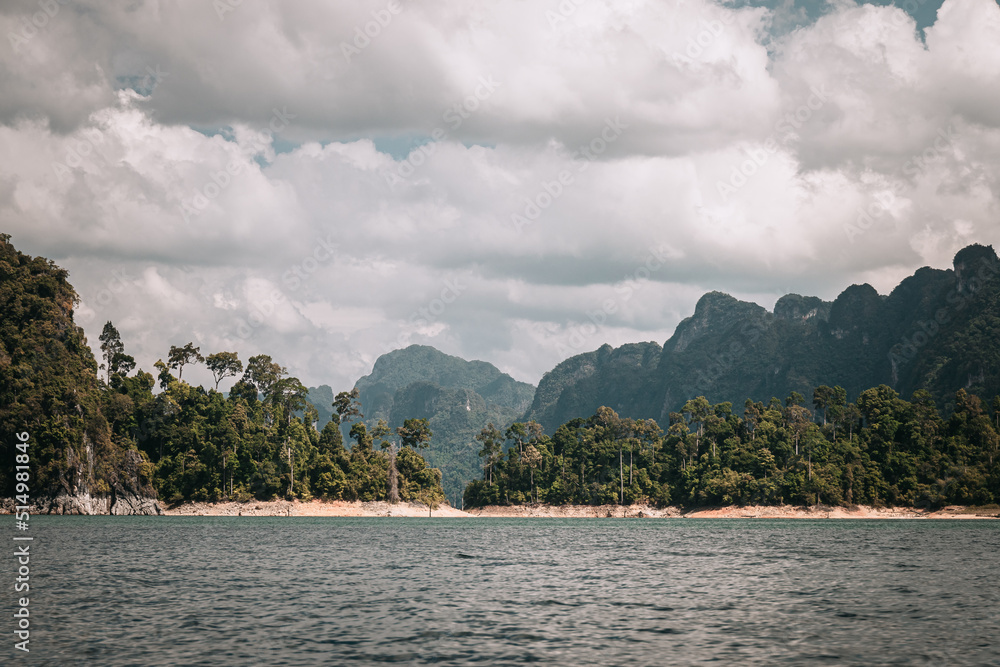 Khao Sok, Thailand - December 20th, 2019 : cliffs on the banks of the lake in the Thai national park of Khao Sok