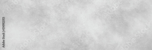 A grey white coloured textured wall background that is empty.