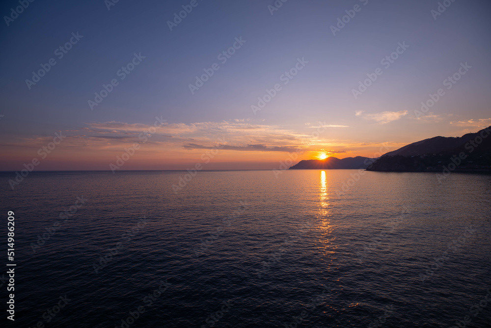 Sunset at the Mediterranean Sea in 5 Terre. Beautiful Sunrise over Sea.