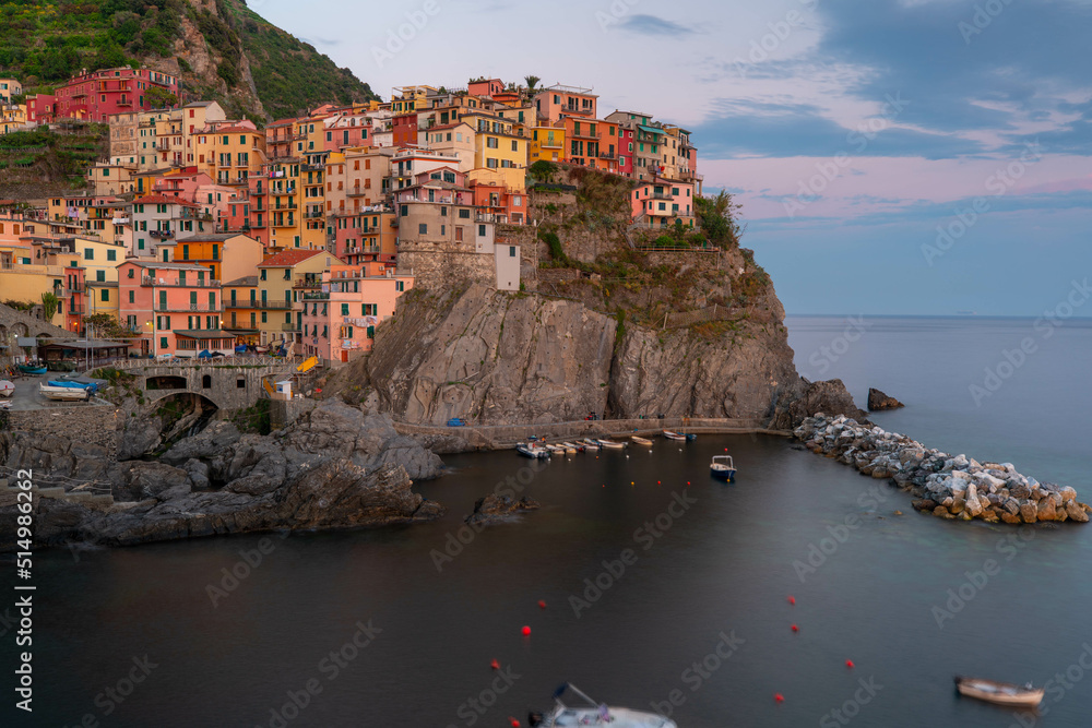 Manarola in 5 Terre, beautiful little town in Italy during sunset. Popular and famous tourist destination in Italy