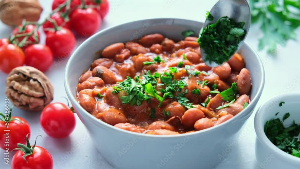 Lobio - dish of Georgian cuisine. Red bean stew with tomato sauce, nuts and herbs. Lobio - dish of Georgian cuisine. Red bean stew with tomato sauce, nuts and herbs.
