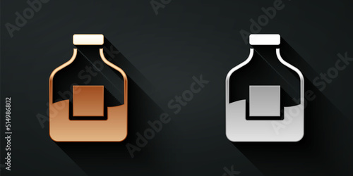 Gold and silver Glass bottle of vodka icon isolated on black background. Long shadow style. Vector