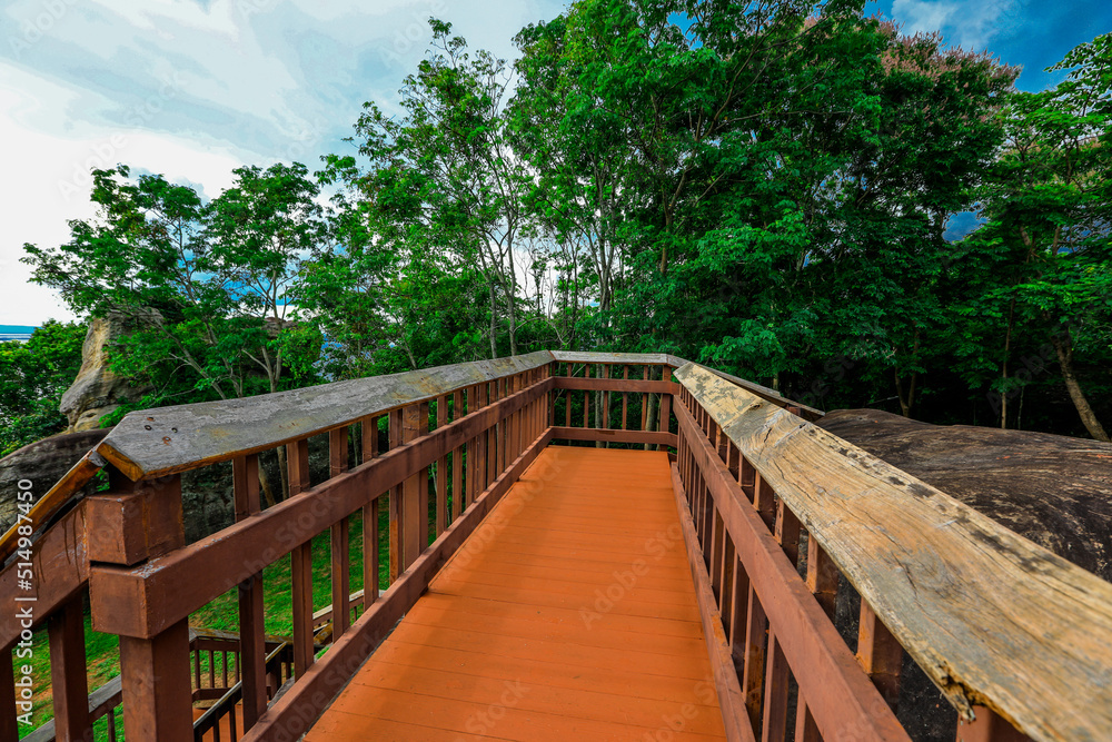 Background of wooden walkways (wooden bridges) created for high-angle views on mountains, natural attractions, or parks that have forest preservation