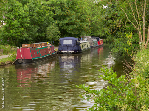 Boats moored for the night just below Hirst Lock on a favourite stretch of the Leeds and Liverpool Canal for visitors to the World Heritage Site of Saltaire