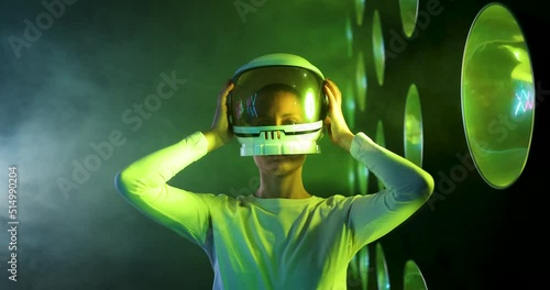 Female astronaut putting on space helmet in metaverse