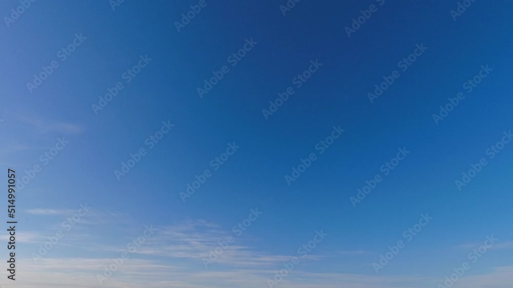 Colorful cirrus sunset clouds drift across evening blue sky, timelapse Colorful cirrus sunset clouds drift across evening blue sky, timelapse