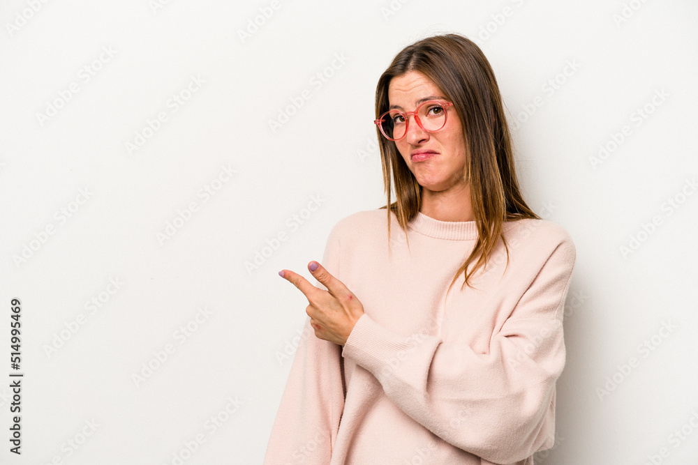 Young caucasian pregnant woman isolated on white background smiling and pointing aside, showing something at blank space. Young caucasian pregnant woman isolated on white background smiling and pointing aside, showing something at blank space.