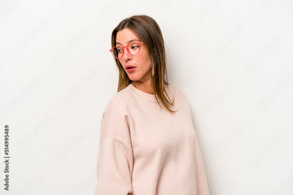 Young caucasian pregnant woman isolated on white background looks aside smiling, cheerful and pleasant. Young caucasian pregnant woman isolated on white background looks aside smiling, cheerful and pleasant.