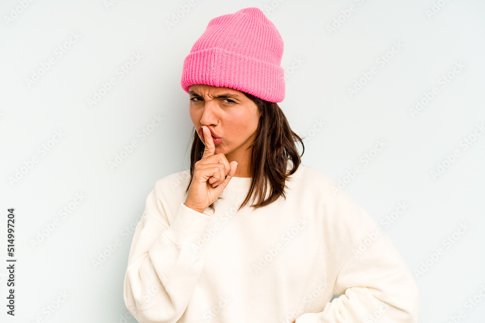 Young hispanic woman isolated on blue background making up plan in mind, setting up an idea. Young hispanic woman isolated on blue background making up plan in mind, setting up an idea.