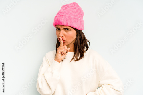 Young hispanic woman isolated on blue background making up plan in mind, setting up an idea.
