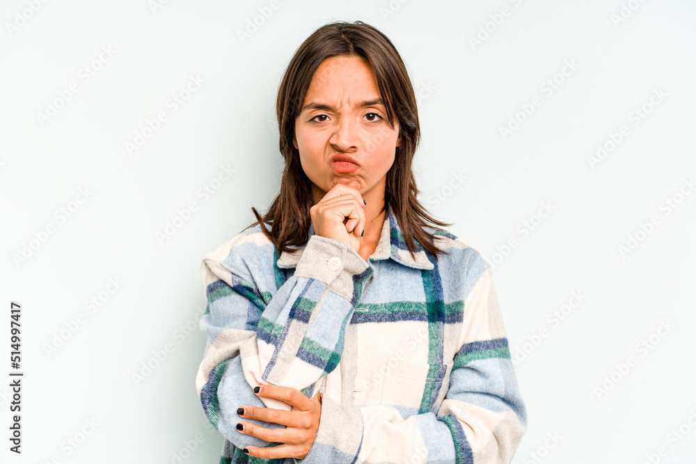 Young hispanic woman isolated on blue background showing number two with fingers. Young hispanic woman isolated on blue background showing number two with fingers.