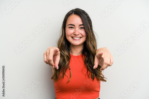 Canvas Print Young caucasian woman isolated on white background cheerful smiles pointing to front