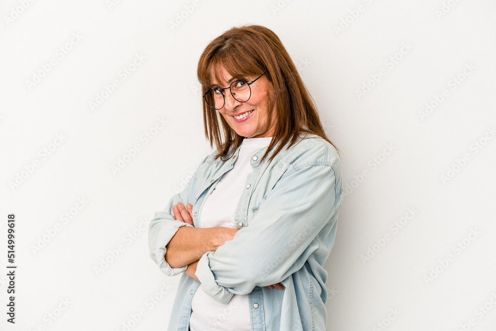 Middle age caucasian woman isolated on white background who feels confident, crossing arms with determination. Middle age caucasian woman isolated on white background who feels confident, crossing arms with determination.