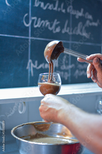 Making chocolate mousse. Mixing in a bowl.