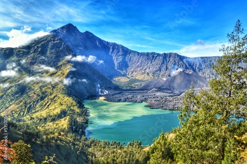 Segara Anak lake with the peak of Mount Rinjani in the background from the Senaru hiking trail