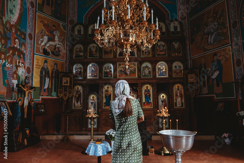 Fotografie Back view of woman in the church