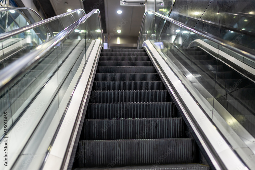 Modern escalator electronic system inside a building. Escalator in Community Mall, Shopping Center. Modern Subway Modern escalator electronic system inside a building. Escalator in Community Mall, Shopping Center. Modern Subway